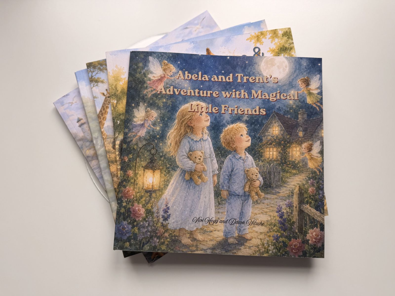 The five Bilingual Storybook Land picture books arranged on a table